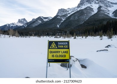 Canmore, Alberta, Canada - January 19 2022 : Frozen Quarry Lake Closed In Winter.