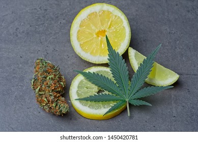 Cannabis Bud And Leaf With Sliced Lemon Depicting Limonene Terpene.