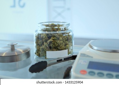 Cannabis Buds In Jar With Scale For Sale  In Recreational Dispensary