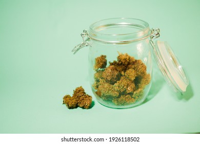 Cannabis Buds Stored In Glass Jar. Medical Marijuana Shop. 420 Culture