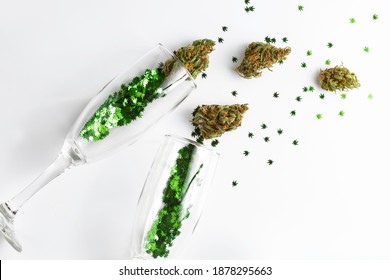 Cannabis in champagne flutes cheers for celebration. Cannabis confetti concept for New Years, Birthday, Party, anniversary and wedding.