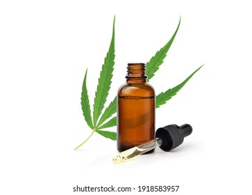 Cannabis Essential Oil Extract In Dropper Bottle With Green Leaf Isolated On White Background.