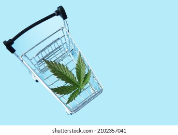 Cannabis Leaf Lay In Shopping Cart. CBD Marijuana Shop. Weed Delivery Concept 