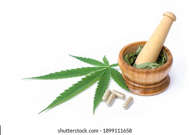 Cannabis Leaf And Marijuana Powder Capsule Isolated On White Background.