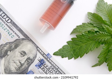 Cannabis leaves, syringe, one hundred dollars. The legality of cannabis, legal and illegal in the world. Business concept for cannabis, medical marijuana stock market. Dollar THC CBD Cannabis 