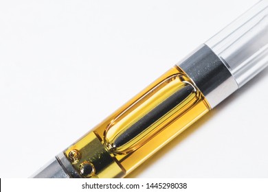 cannabis liquid extract up-close in plastic cartridge to vape and inhale the medicinal cannabinoids THC & CBD in a concentrated wax form 