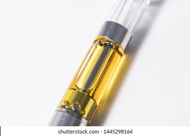cannabis liquid extract up-close in plastic cartridge to vape and inhale the medicinal cannabinoids THC & CBD in a concentrated wax form 