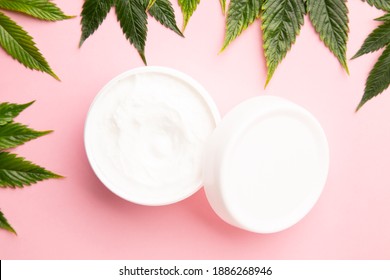 Cannabis Lotion Topical With Marijuana Leaf And Lid On Pink Background