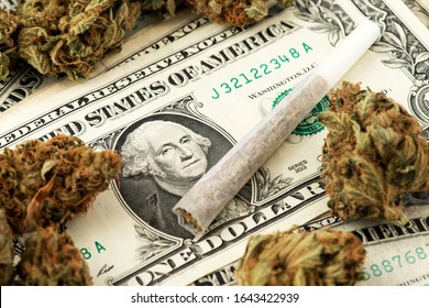 Cannabis Marijuana buds with joint on US Dollar. Marijuana Cannabis business concept. Medical Marijuana stock market concept. THC CBD Dollar Cannabis Marijuana Joint