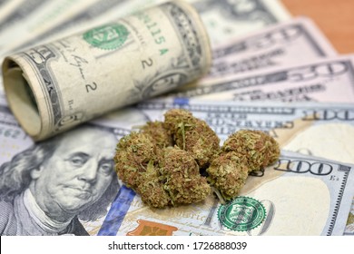 Cannabis Marijuana buds with joint on US Dollar. Marijuana Cannabis business concept. Medical Marijuana stock market concept. CBD Dollar Cannabis THC Marijuana. Drug trading concept.
