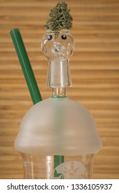 Cannabis Nug Perched On Top Of A Dab Rig