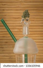 Cannabis Nug Perched On Top Of A Dab Rig