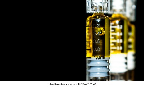 Cannabis Oil with THC for Vaping Marijuana, on Black Background 