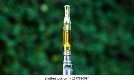 Cannabis Oil, Vape Pen. Vaping Marijuana THC and CBD 