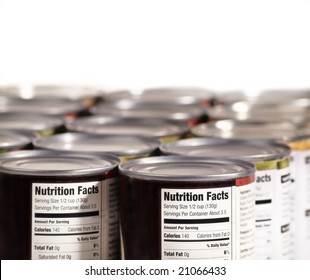 Canned Food Lined Up On Shelf With Nutrition Fact Label