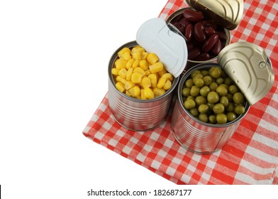 Canned Food On Tablecloth Isolated On White