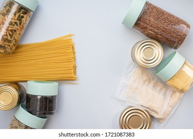 Canned food, pasta, groats and pasta on a blue background. Donates for low-income families during the coronavirus - Shutterstock ID 1721087383