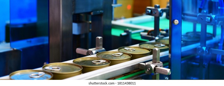 Canned Food Products On Conveyor Belt In Distribution Warehouse.parcels Transportation System Concept