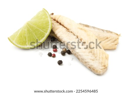 Canned mackerel fillets with lime and spices on white background