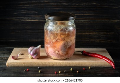 Canned Meat Jar On Kitchen Cutting Board After Cooking. Stocking Food In Case Of Famine. Space For An Inscription.