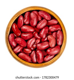 Canned Red Kidney Beans In Wooden Bowl, Also Known As Common Kidney Bean, Rajma Or Surkh. A Variety Of The Common Bean, Phaseolus Vulgaris. Closeup, From Above, Over White, Isolated, Macro Food Photo.