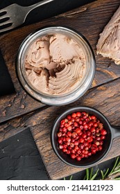 Canned Tuna Fillet Meat In Olive Oil, On Black Background, Top View