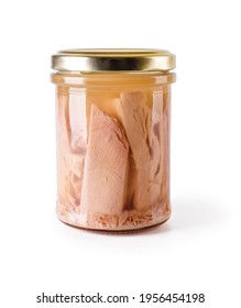 Canned Tuna Fillet Pieces In A Glass Jar With Yellow Metal Lid Isolated On White Background. Preserved Tuna Fish Meat As Ingredient Of Low Calories Healthy Eating. Seafood Design Element. Front View.