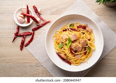 Canned Tuna Spaghetti With Dried Chili And Garlic In White Plate.Fusion Food.Top View