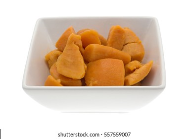 Canned Yams In A Square Bowl Isolated On A White Background. 