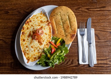 Cannelloni With Garlic Flatbread And Salad - TopView