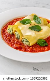Cannelloni pasta stuffed with ricotta and spinach with tomato sauce