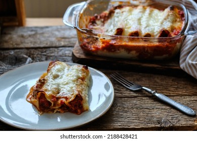 Cannelloni Pasta Tubes Packed With A Chees And Chicken Filling, Topped With A Tomato Sauce.