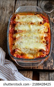 Cannelloni Pasta Tubes Packed With A Chees And Chicken Filling, Topped With A Tomato Sauce.