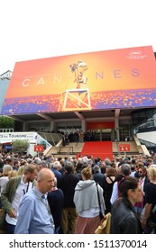 CANNES, FRANCE - 05/21/2019: Crowd Gathered In Front Of Palais Des Festivals Et Des Congrès (Palace Of Festivals And Conferences) Waiting For Movie Stars.