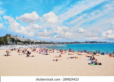 CANNES, FRANCE - JUNE 2, 2015: People On The Most Popular Beach In Cannes, France  - Plage De La Croisette - The Famous Beach On The Croisette, Known For Its Film Festival. 