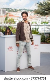 CANNES, FRANCE - MAY 19, 2017: Actor Ghanem Zrelli attends 'Alaka Kaf Ifrit (La Belle Et La Meute)' Photocall during the 70th annual Cannes Film Festival at Palais des Festivals