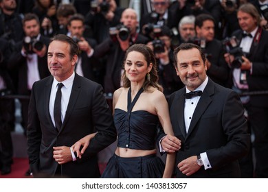 CANNES, FRANCE - MAY 20, 2019: Jean Dujardin, Marion Cotillard and Gilles Lellouche attend the screening of "Le Belle Epoque" during the 72nd annual Cannes Film Festival