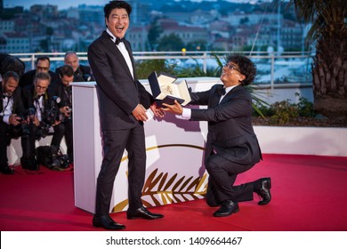 CANNES, FRANCE - MAY 25, 2019: Director Bong Joon-Ho With Kang-Ho Song, Winner Of The Palme D'Or Award For His Film 