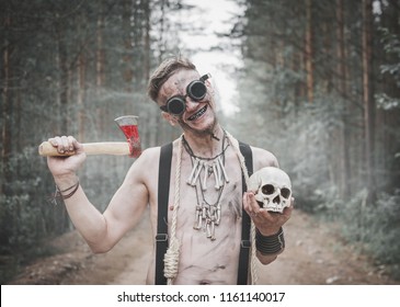 Cannibal Man In Glasses With Ax, Skull And Rope Outdoor