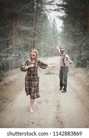 Cannibal Steampunk Man With Ax And His Victim In Forest Outdoor