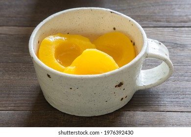 Canning Peaches Isolated In A White Bowl