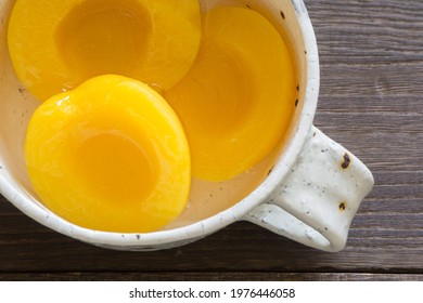 Canning Peaches Isolated In A White Bowl