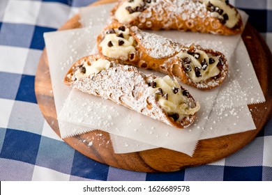 Cannoli. Classic traditional Italian dessert. Italian pastries made with tube-shaped shells of fried pastry dough filled with a sweet, creamy ricotta filling. Traditional Sicilian dessert.