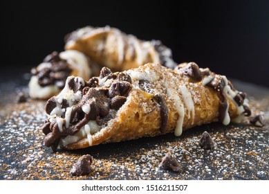  Cannoli pastry on dark background. Selective focus, close-up
