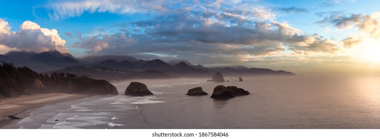 Cannon Beach, Oregon, United States. Beautiful Aerial Panoramic View of the Rocky Pacific Ocean Coast. Dramatic Colorful Sunset Sky. - Powered by Shutterstock