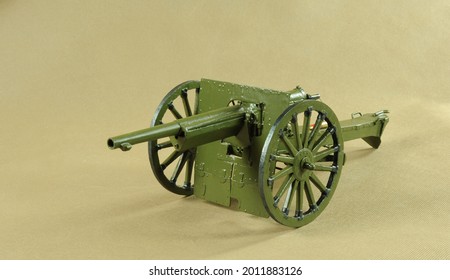 Cannon on a yellow solid background