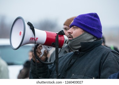 CANNONBALL, NORTH DAKOTA, USA - NOVEMBER 26, 2016: A Dakota Access Pipeline Protester Speaking To A Crowd Using A Megaphone. 