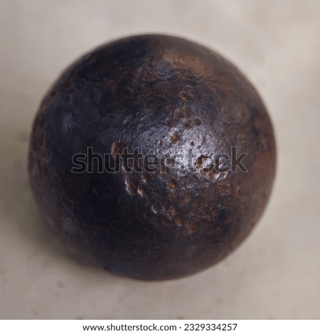 Cannonball six-pound close-up. Old objects of the 18th century era, reenactment of events