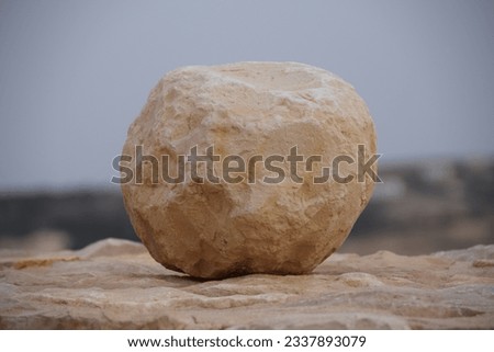 Cannonballs made of stone on the wall of the old crusader castle Shobak in Jordan
