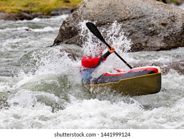 Canoe Descent Through The Rapids